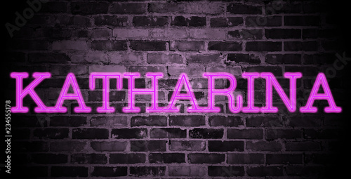 first name Katharina in pink neon on brick wall