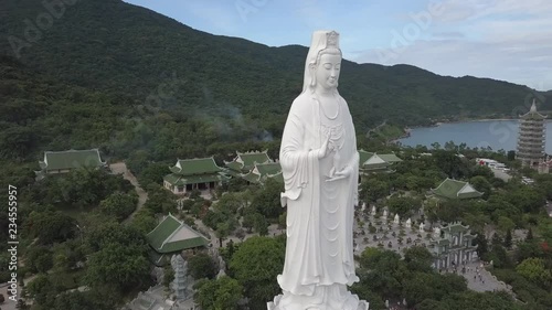 2K Aerial view Lady Buddha close-up Da Nang Vietnam. Big white buddha statue top view. Linh Ung pagoda in Danang city. 