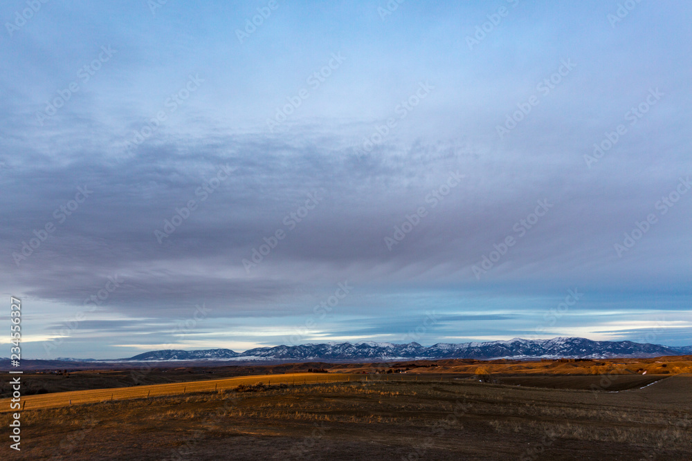 Scenic view of field against cloudy sky Scenic view of field against cloudy sky
