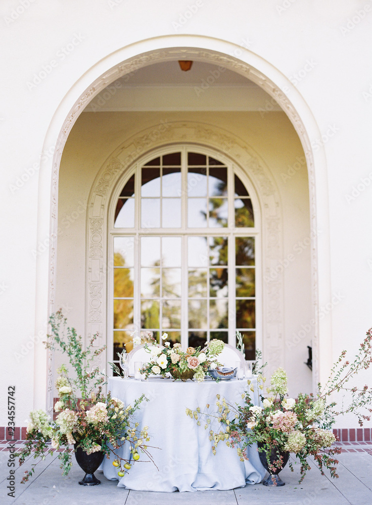 Wedding reception table surrounded by flowers Wedding reception table surrounded by flowers