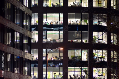 Modern office building at night. Night lights, city office building downtown, cityscape view