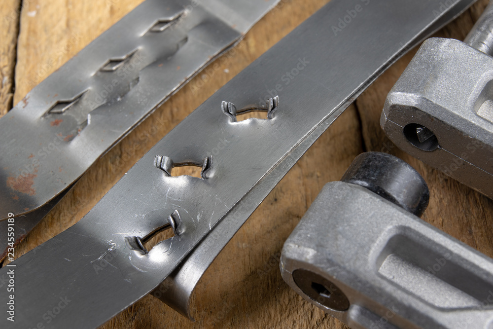 Bonding a sheet metal using a crimper. Small locksmith works in a mechanical workshop. Bonding a sheet metal using a crimper. Small locksmith works in a mechanical workshop.