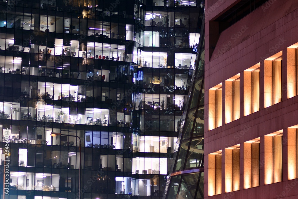 Modern office building at night. Night lights, city office building downtown, cityscape view Modern office building at night. Night lights, city office building downtown, cityscape view
