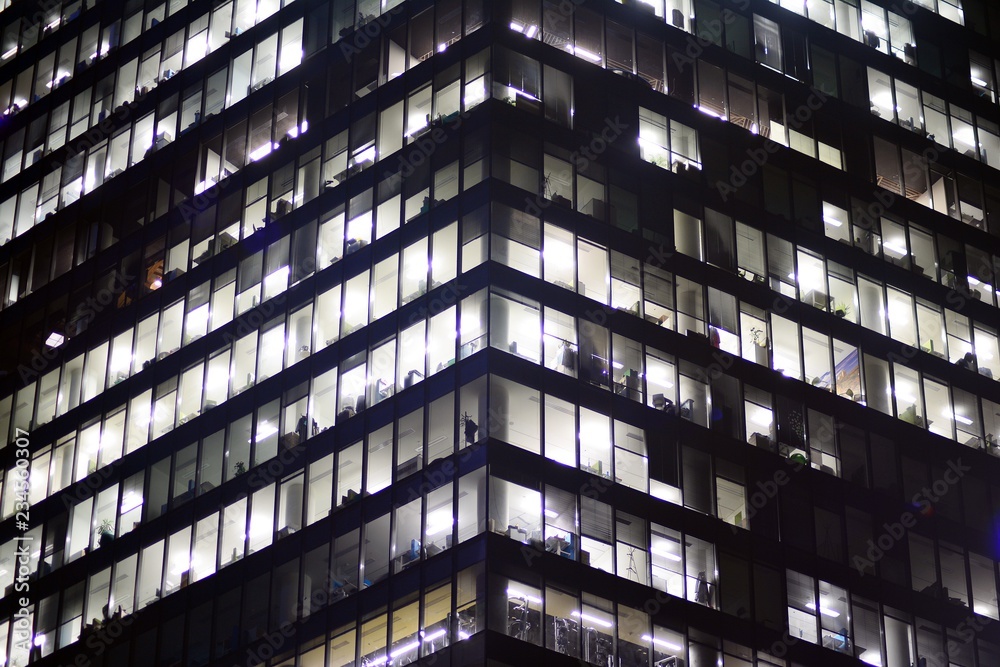 Fototapeta premium Modern office building at night. Night lights, city office building downtown, cityscape view