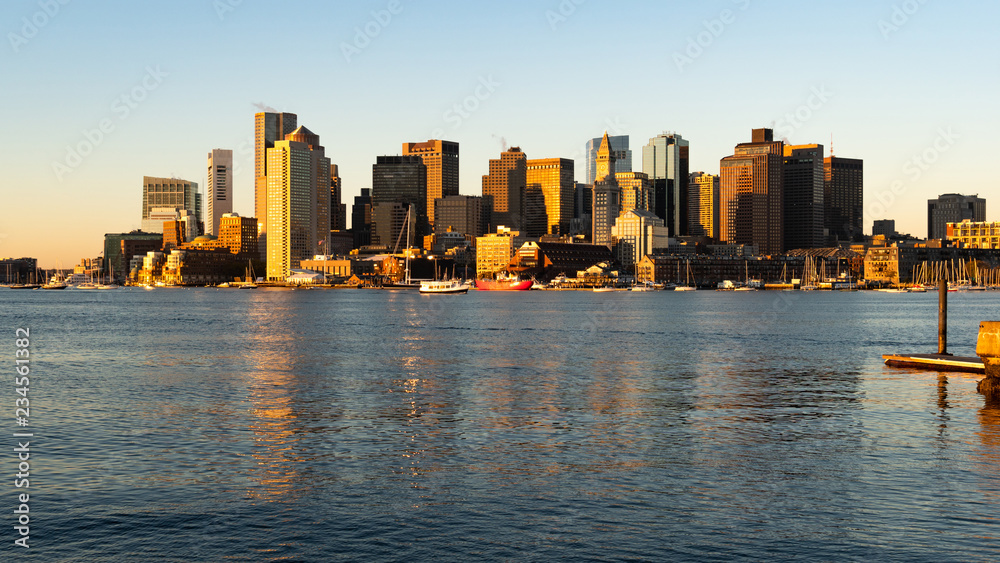 Tall Skyscrapers Reflect light into The Harbor in Downtown Boston Mass