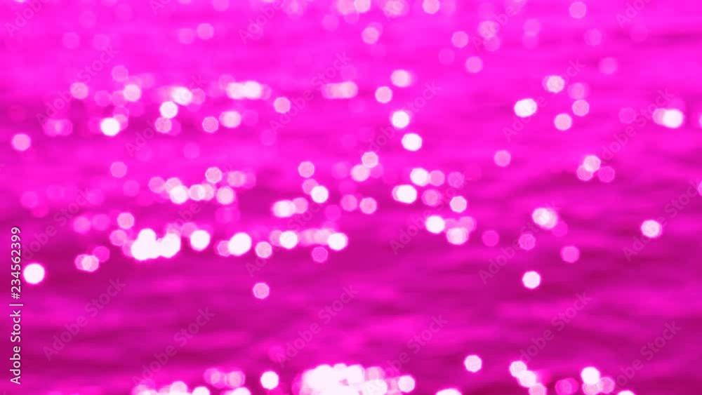 Slow motion, defocused highlights on sunlit lake water. Fuchsia tint. Lake Ontario, Canada. Slow motion, defocused highlights on sunlit lake water. Fuchsia tint. Lake Ontario, Canada.