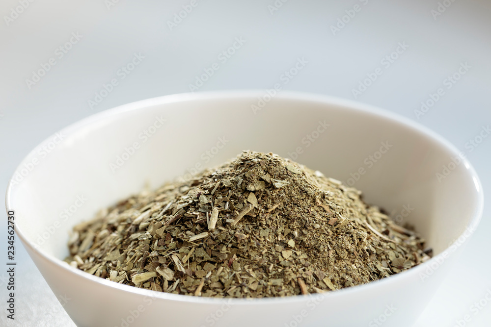 Yerba mate (Ilex paraguariensis) with stems, front view Yerba mate (Ilex paraguariensis) with stems, front view