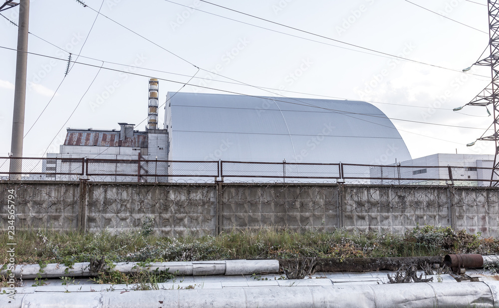 Reactor 4 at the Chernobyl nuclear power plant with a new confinement. Global atomic disaster. Chernobyl Exclusion Zone. Pripyat in the area of the sarcophagus over a blasted nuclear reactor Reactor 4 at the Chernobyl nuclear power plant with a new confinement. Global atomic disaster. Chernobyl Exclusion Zone. Pripyat in the area of the sarcophagus over a blasted nuclear reactor