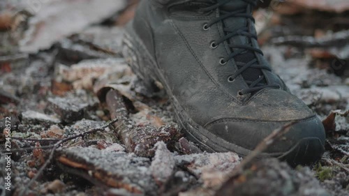 tactical winter boot step in the wild nature