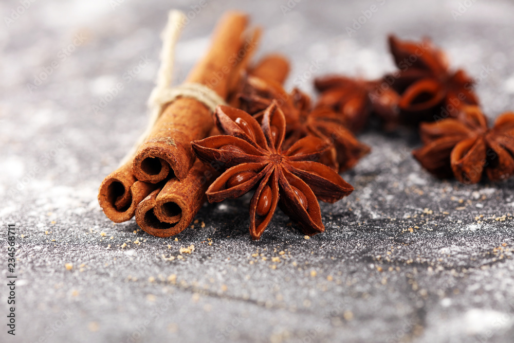 cinnamon and staranise winter spices on rustic background cinnamon and staranise winter spices on rustic background