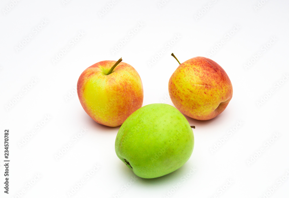 Group of ripe red apples isolated on white background. Green apples and apple cut with clipping path Group of ripe red apples isolated on white background. Green apples and apple cut with clipping path