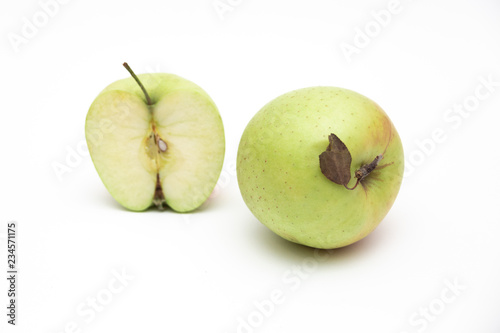 Ripe green apple fruit with apple half and green apple leaf isolated on white background. Apples with clipping path
