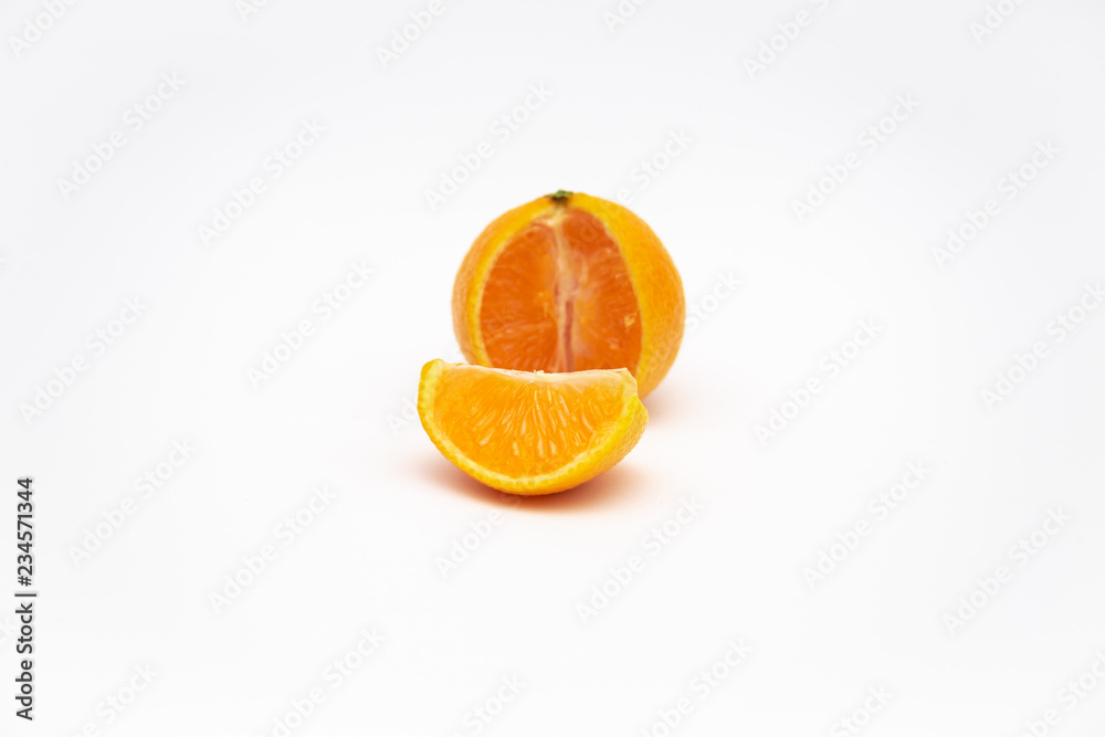 Ripe mandarin close-up on a white background. Tangerine orange on a white background. Ripe mandarin close-up on a white background. Tangerine orange on a white background.