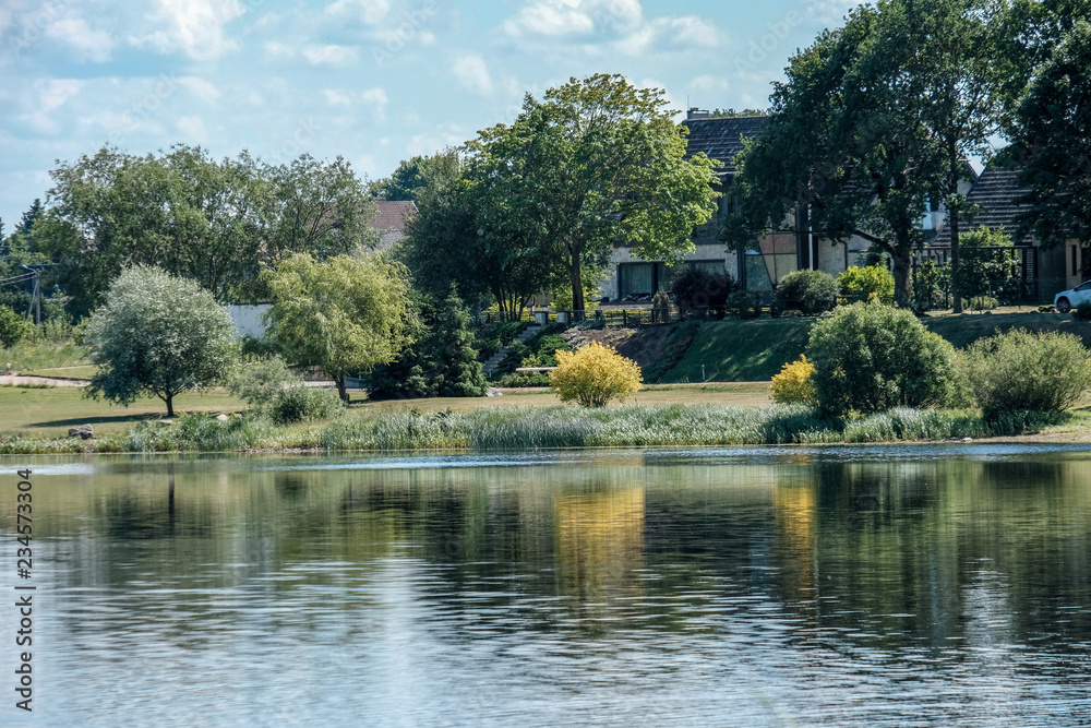 calm summer day view by the lake with clean water