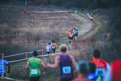 Photos Trail race, cross country athlete on autumn field