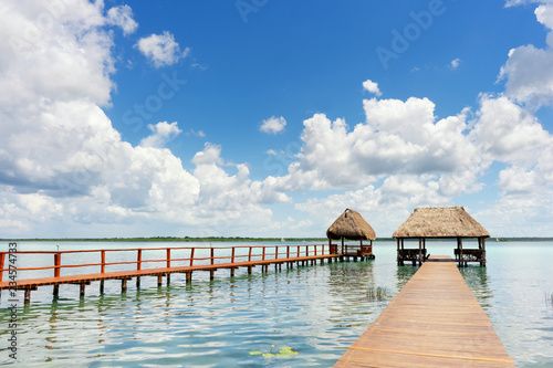 Dock with palapa in lagoon © Guajillo studio