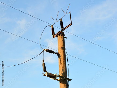 A pole with electrical wires. High-voltage power lines.