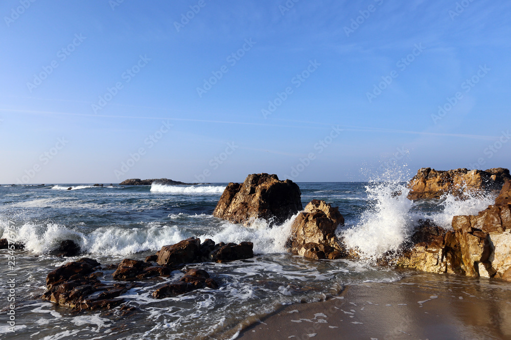 Crashing Waves on rocks in Monterey Bay, central California coast Crashing Waves on rocks in Monterey Bay, central California coast