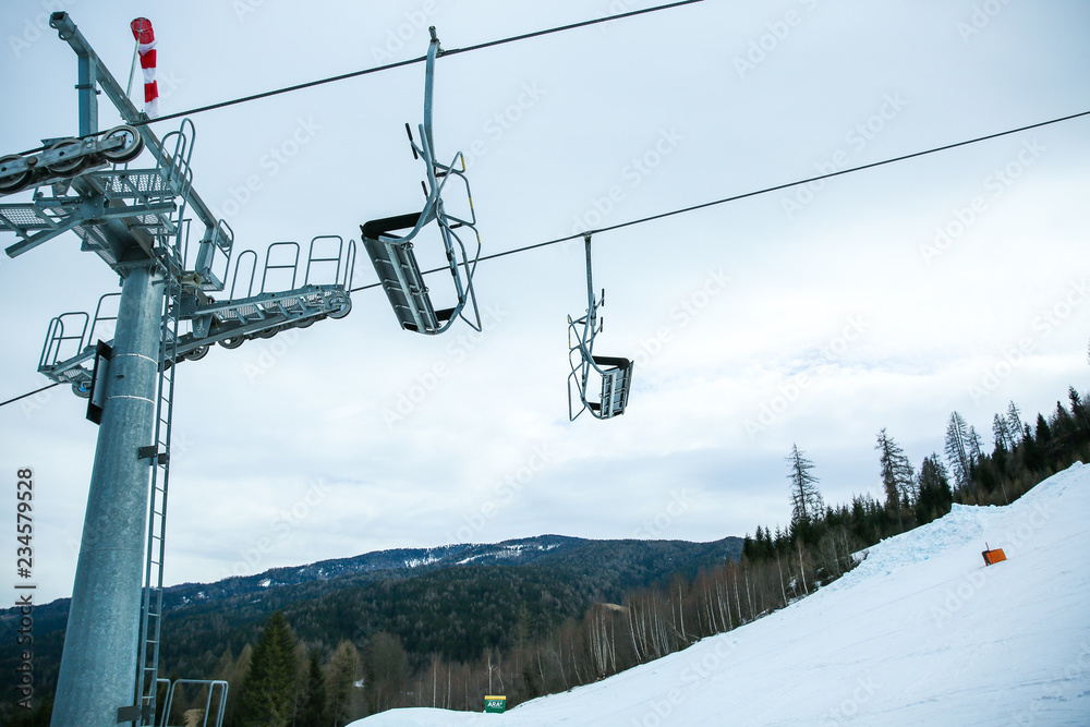 Winter mountains panorama with ski slopes and ski lifts. Alps. Austria. Winter mountains panorama with ski slopes and ski lifts. Alps. Austria.