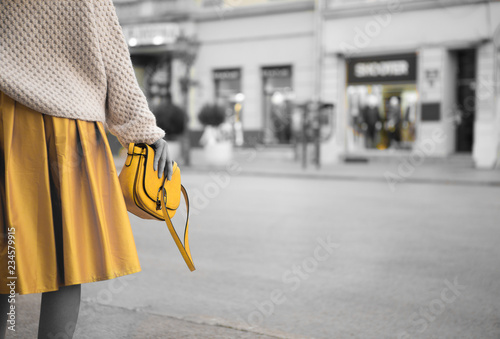 Obraz na plátně Yellow skirt and yellow women's purse.