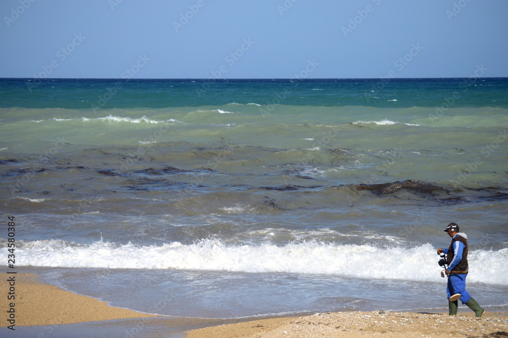 Treasure hunter at the Mediterranean coast