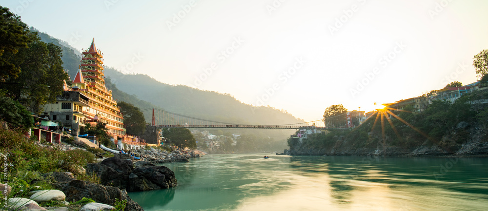 Spectacular view of the Lakshman Temple bathed by the sacred river Ganges at sunset.
