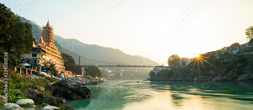 Spectacular view of the Lakshman Temple bathed by the sacred river Ganges at sunset.  photo
