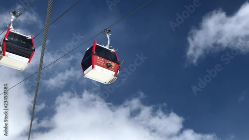 sunny day winter time gudauri ski resort lift ride slow motion up view 4k georgia
 photo