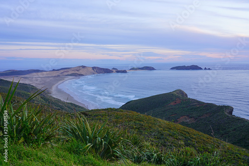 View of the TePaki Giant Sand Dunes at Cape Reinga (Te Rerenga Wairua), the northwesternmost tip of the Aupouri Peninsula, at the northern end of the North Island of New Zealand photo