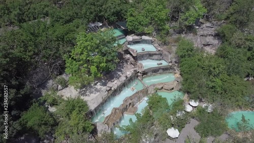 2K Aerial view of thermal waterfalls at I-Resort, Nha Trang Vietnam. Natural waterfalls among trees