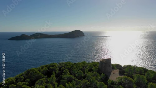 A bird's-eye view in the morning from the eastern cape of Ibiza island to the island Illa de Tagomago . Mediterranean Sea. photo