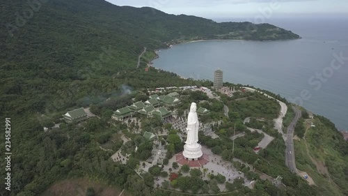 2K Aerial view Lady Buddha close-up Da Nang Vietnam. Big white buddha statue top view. Linh Ung pagoda in Danang city. 