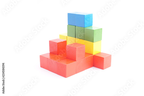 Colorful wooden cube isolated on white background.