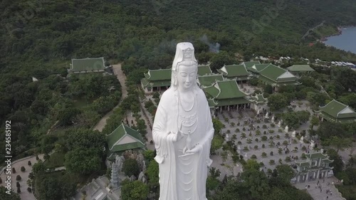 2K Aerial view Lady Buddha close-up Da Nang Vietnam. Big white buddha statue top view. Linh Ung pagoda in Danang city. 