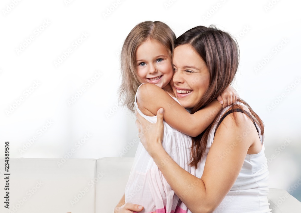 Happy Mother and daughter hugging Happy Mother and daughter hugging
