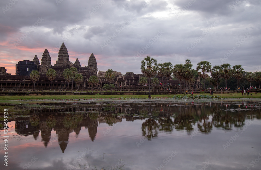 Golden sky form Sunrise view of ancient temple complex at entrance of Angkor Wat in Siem Reap, Cambodia the World Heritage (one of Seven Wonders of the Word). Golden sky form Sunrise view of ancient temple complex at entrance of Angkor Wat in Siem Reap, Cambodia the World Heritage (one of Seven Wonders of the Word).