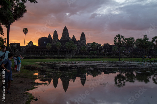 Golden sky form Sunrise view of ancient temple complex at entrance of Angkor Wat in Siem Reap  Cambodia the World Heritage  one of Seven Wonders of the Word .