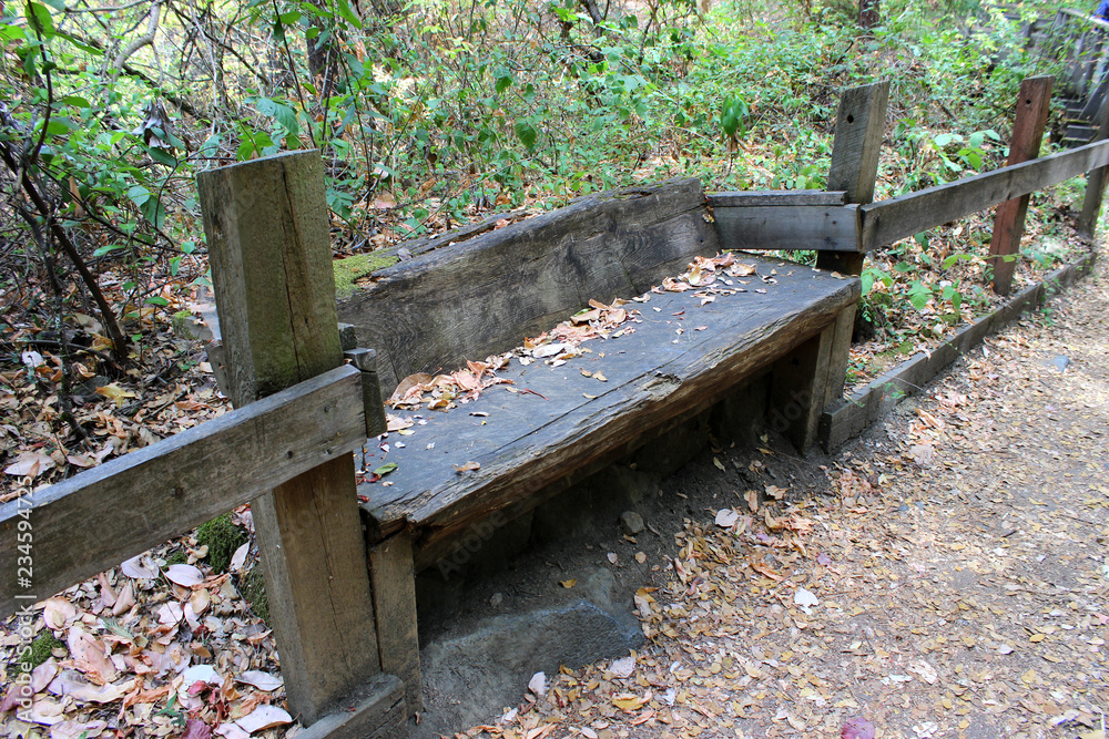 old worn wooden park bench