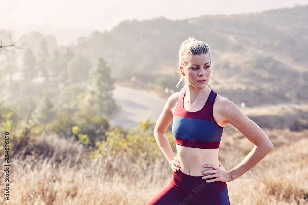 Beautiful Caucasian White Woman Takes A Break from Her Workout in the Morning Sunlight Beautiful Caucasian White Woman Takes A Break from Her Workout in the Morning Sunlight