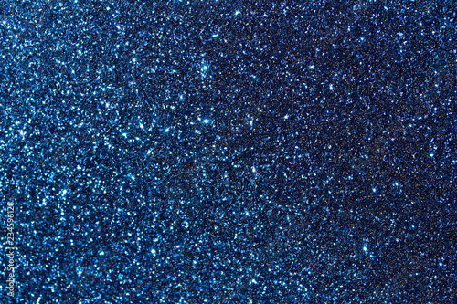 Sparkling macro blue glitter bokeh abstract background