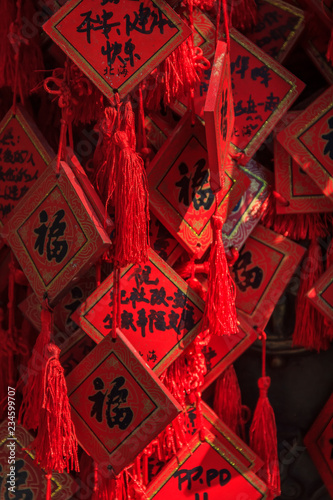 New Year wishes on red charms in Buddhist Yong'An (Temple of Everlasting Peace) in Beihai Park, Beijing, China photo