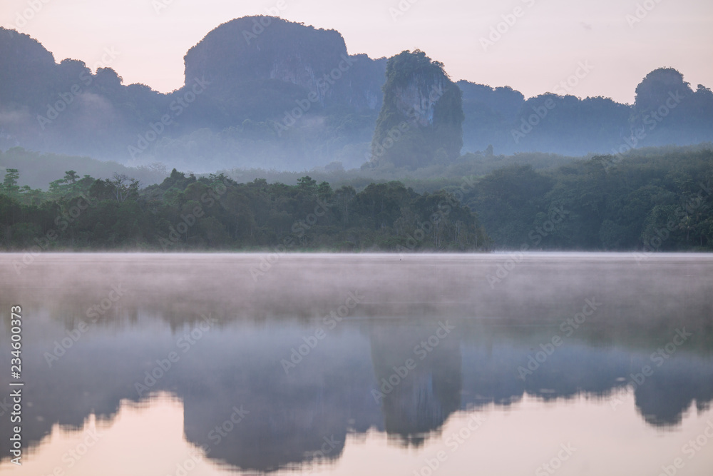 Backgrounds of scenery (nature), wallpaper close (mountains, swamps, trees) with a colorful atmosphere morning sunrise, natural beauty, seen during the trip.