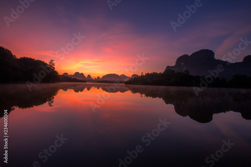 Backgrounds of scenery  nature   wallpaper close  mountains  swamps  trees  with a colorful atmosphere morning sunrise  natural beauty  seen during the trip.