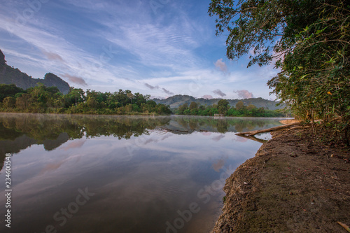 Backgrounds of scenery (nature), wallpaper close (mountains, swamps, trees) with a colorful atmosphere morning sunrise, natural beauty, seen during the trip.