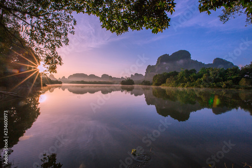 Backgrounds of scenery (nature), wallpaper close (mountains, swamps, trees) with a colorful atmosphere morning sunrise, natural beauty, seen during the trip.