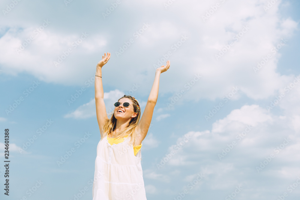 Beautiful woman in sunglasses relaxing at beach on a sunny day .. Beautiful woman in sunglasses relaxing at beach on a sunny day ..