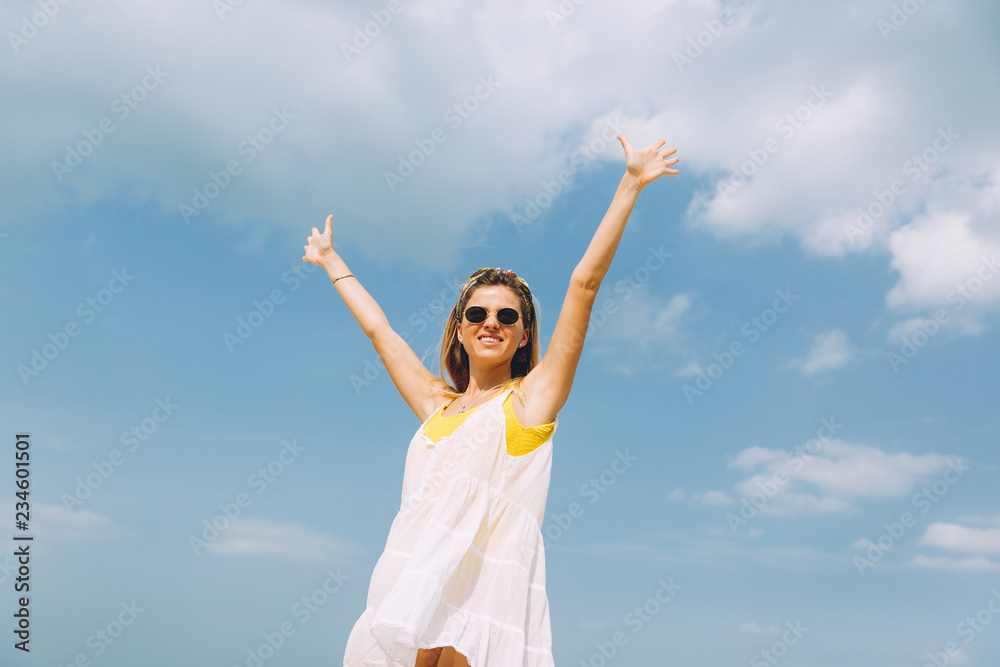 Beautiful woman in sunglasses relaxing at beach on a sunny day .. Beautiful woman in sunglasses relaxing at beach on a sunny day ..