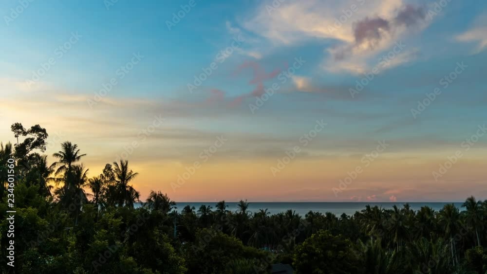Colourful sunrise over trees, sea and roof of houses on a tropical island Koh Samui. 4k time lapse Colourful sunrise over trees, sea and roof of houses on a tropical island Koh Samui. 4k time lapse