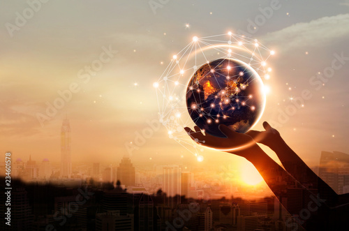 Abstract science, hands touching earth and circle global network connection communication on sunset background, technology and innovation. Elements of this image furnished by NASA