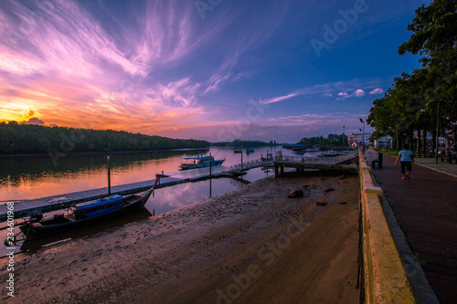 Krabi  August 31 2018  Morning light at Chao Fa Beach  Black Crab Floating Market  fishing boats docked and waiting to fish again in Muang District  Thailand.